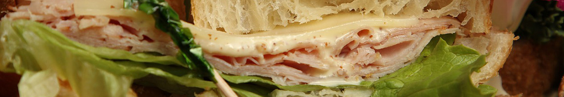 Eating Sandwich Cafe at Specialty's Café & Bakery.